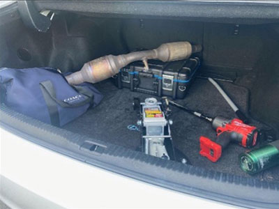 catalytic converter in trunk with tools