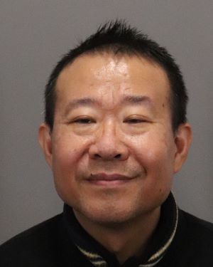 Suspect Zhen Wang 44 YO